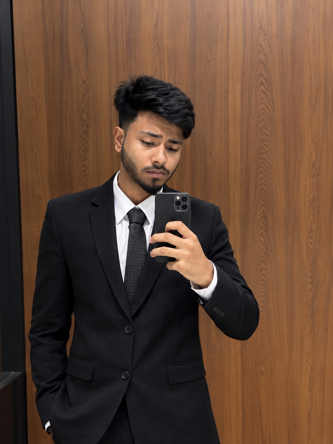 Mehedi Hasan Robiul wearing a black suit